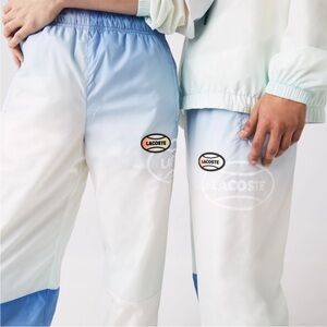 Lacoste Unisex Windbreaker Pants in White and Light Blue